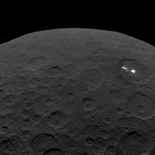 One of the last images of Ceres from NASA's Dawn spacecraft shows bright spots in Occator Crater. Dawn captured this view on Sept. 1, 2018, from an altitude of 2,340 miles (3,370 kilometers) above the dwarf planet's surface.