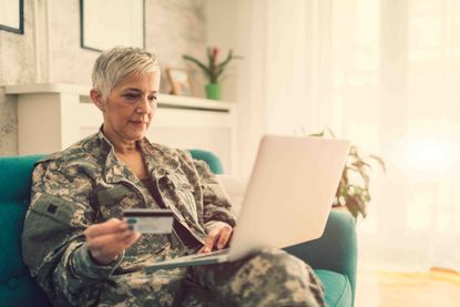 A veteran looking at a laptop.