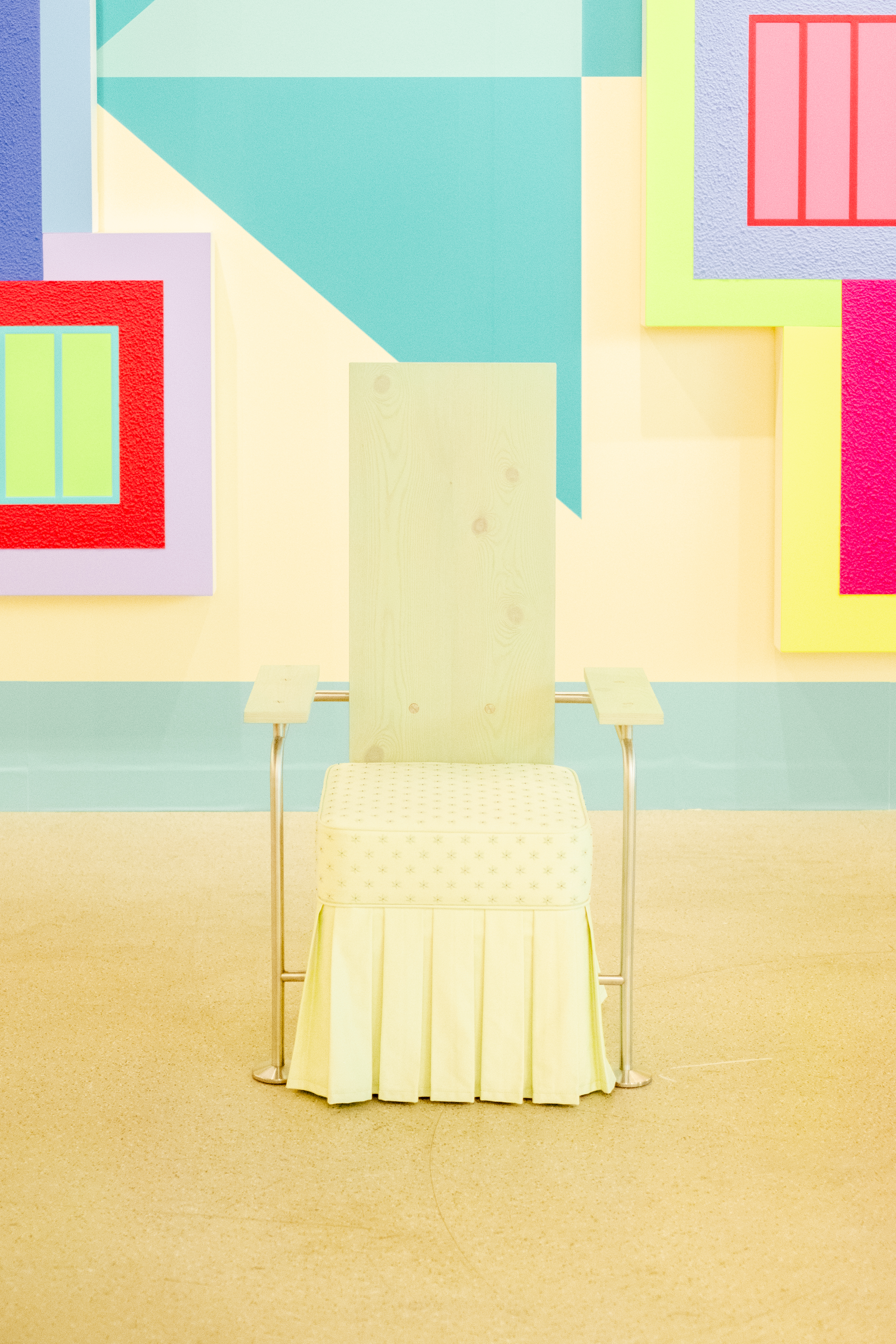 Two furniture-inspired art installations feature beige-tinted home decor with a nostalgic feel.