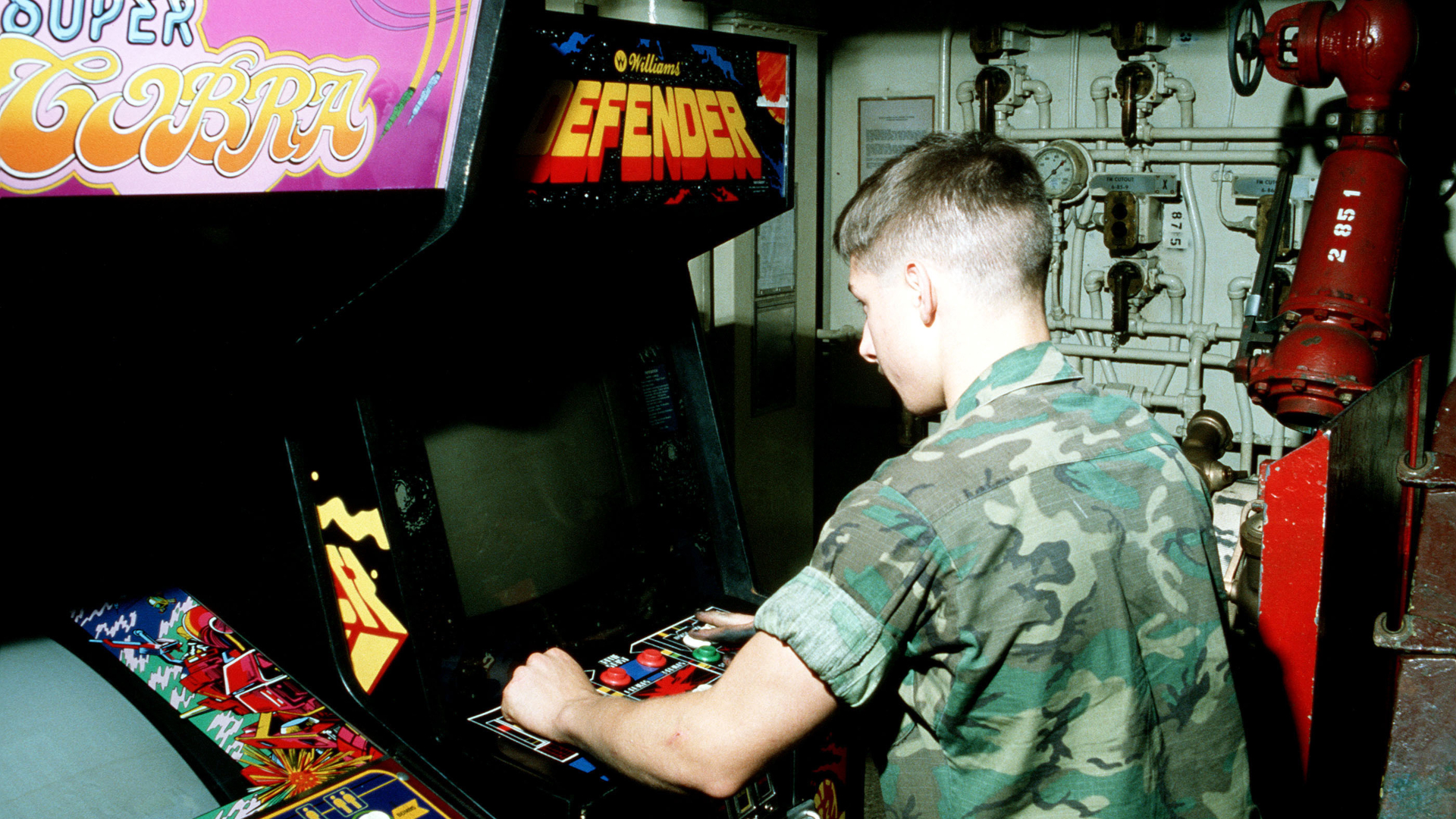 An American Marine playing Defender aboard a naval ship in 1982