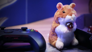 A promotional image for Dungeons & Dragons Direct. There is a game controller in the bottom left. A plushie of the hamster Boo is holding a 20-sided dice.