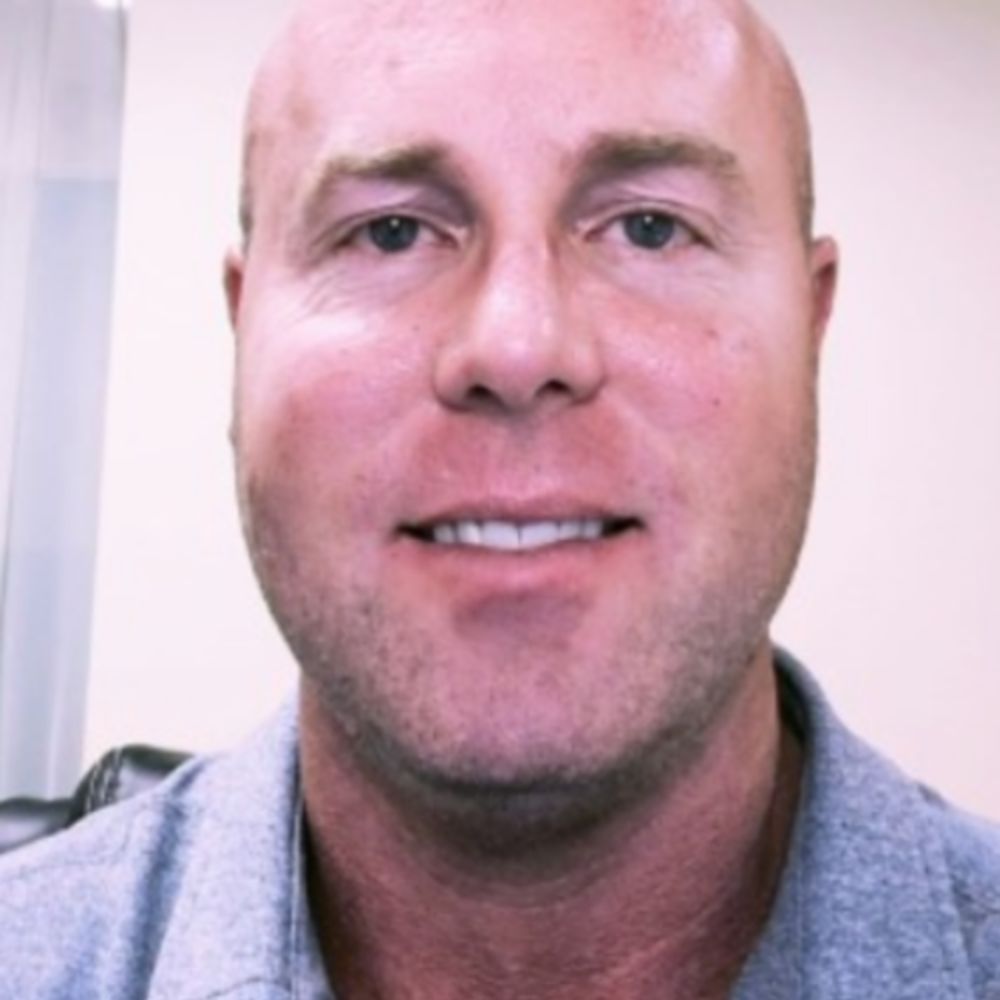 A headshot of Todd Harman