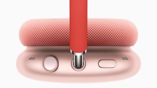 A close up of the side of the cup of the apple airpods max in red