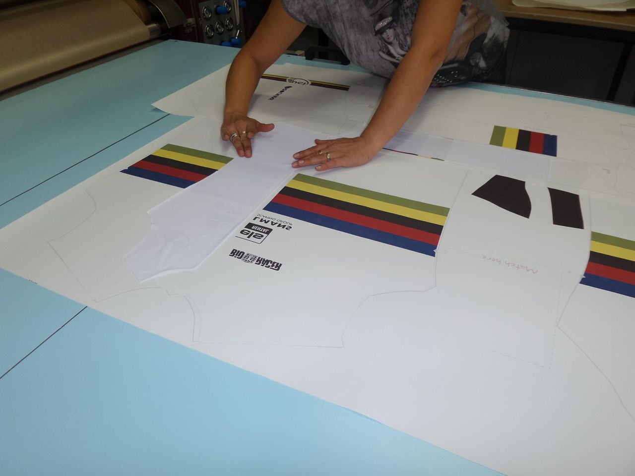 Sublimating the white fabric with the printed design