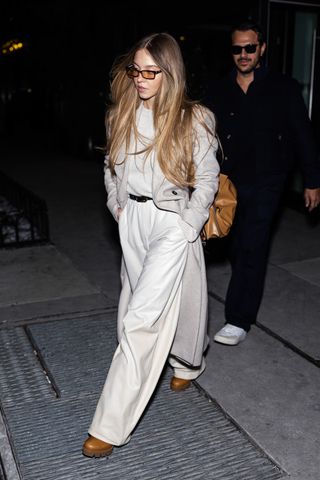 Sydney Sweeney wears platform boots + wide leg trousers