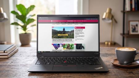 An image of a Lenovo ThinkPad showing the Windows Central homepage open in Google Chrome with a Windows Vista style Taskbar thanks to the RetroBar app. 