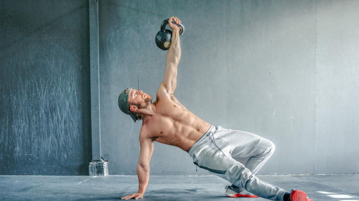 Man working out with a kettlebell