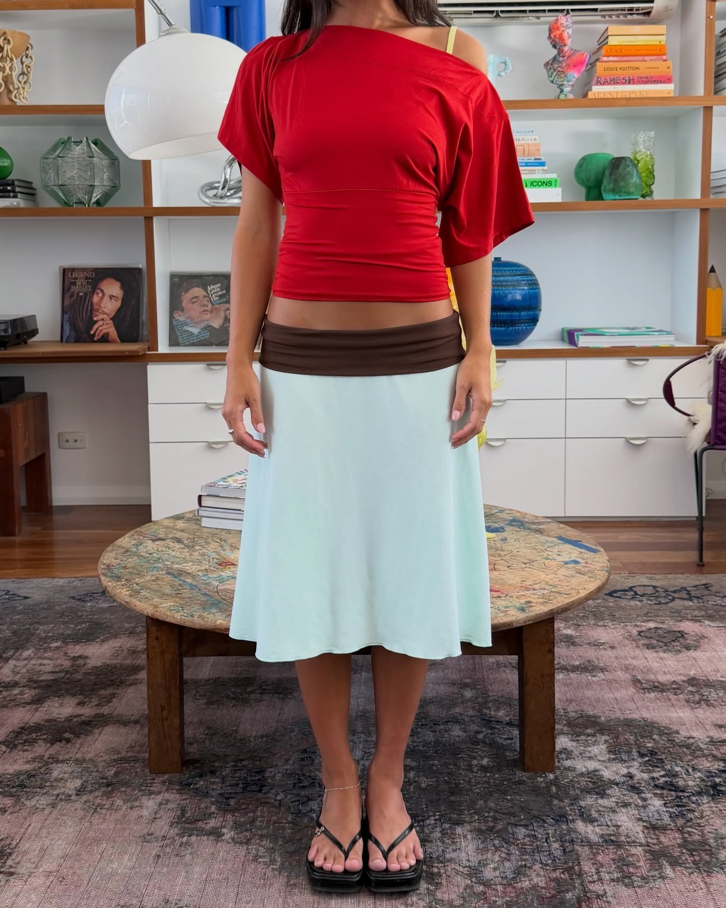 Influencer wearing two-tone midi skirt summer trend.