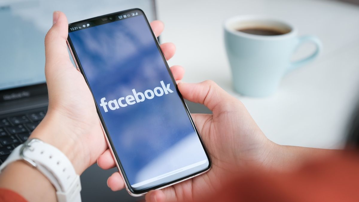 Facebook logo on a phone display