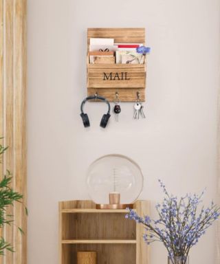 A wooden key holder in an entryway