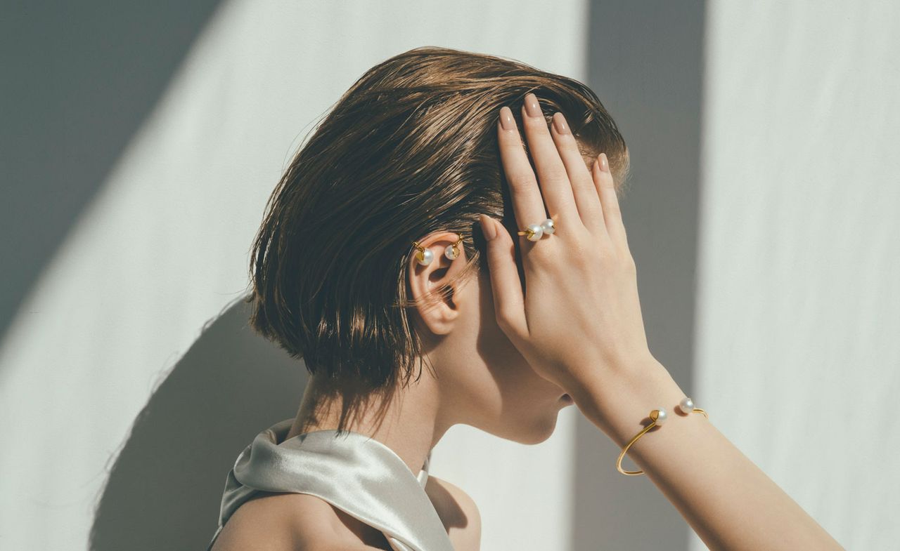 Woman wearing pearl jewellery by M/G Tasaki