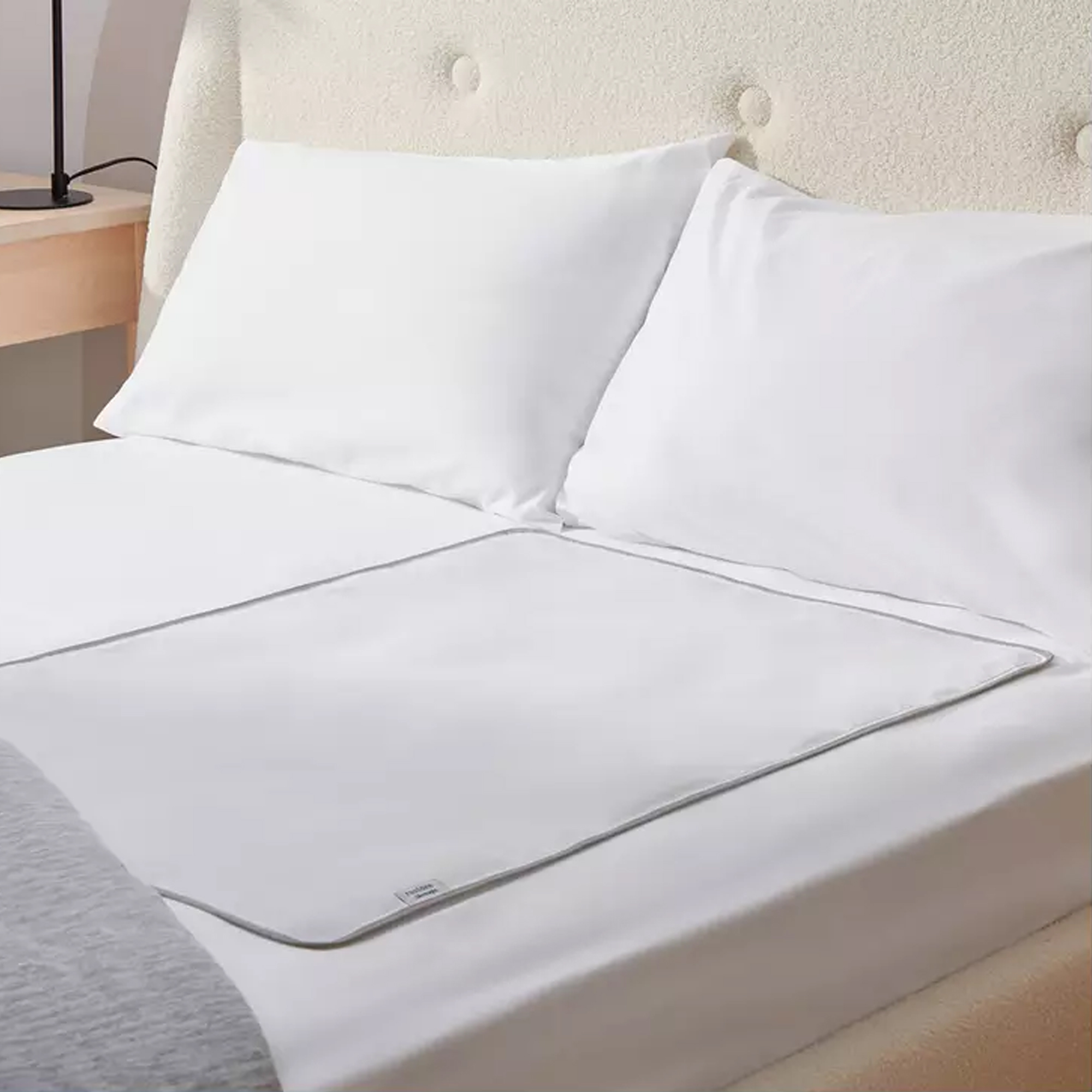 Silentnight Restore Body Cooling Gel Mattress Pad on a bed