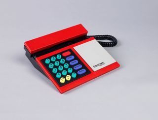 Red Beocom phone from 1986, with keys in teal, lilac, red and yellow