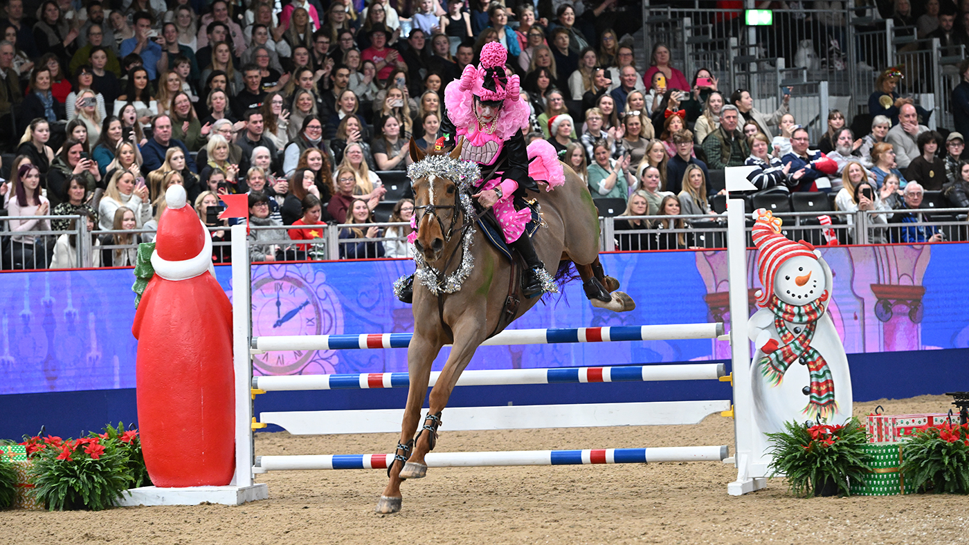 John Whitaker in the fancy dress jumping at London International