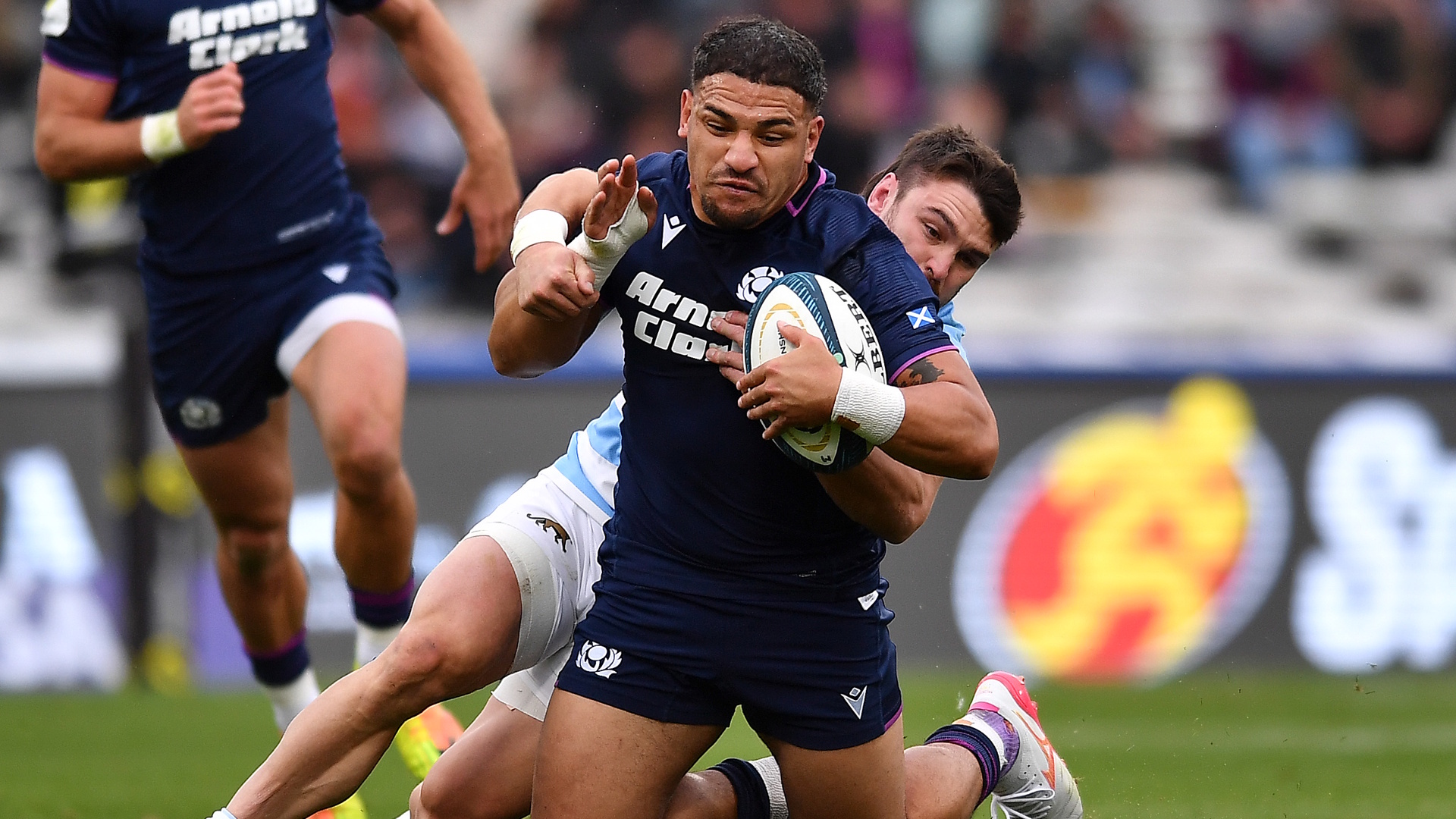 Captain Sione Tuipulotu of Scotland is tackled during a 2026 Nations Championship rugby union match.