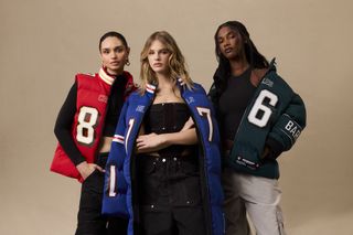 Three women wear custom patchwork jersey jackets from the launch of the label Off Season