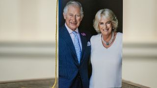 n image of Britain's King Charles III and Camilla, Queen Consort, is seen on the front of one of the first birthday cards to be sent to members of the public celebrating 100 years of age, signed by King Charles III and the Queen Consort, at Buckingham Palace in London on October 23, 2022
