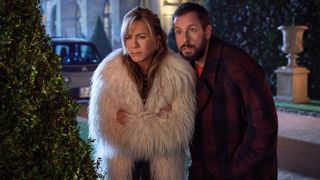 Jennifer Aniston and Adam Sandler as Audrey and Nick Spitz in winter coats in Murder Mystery 2