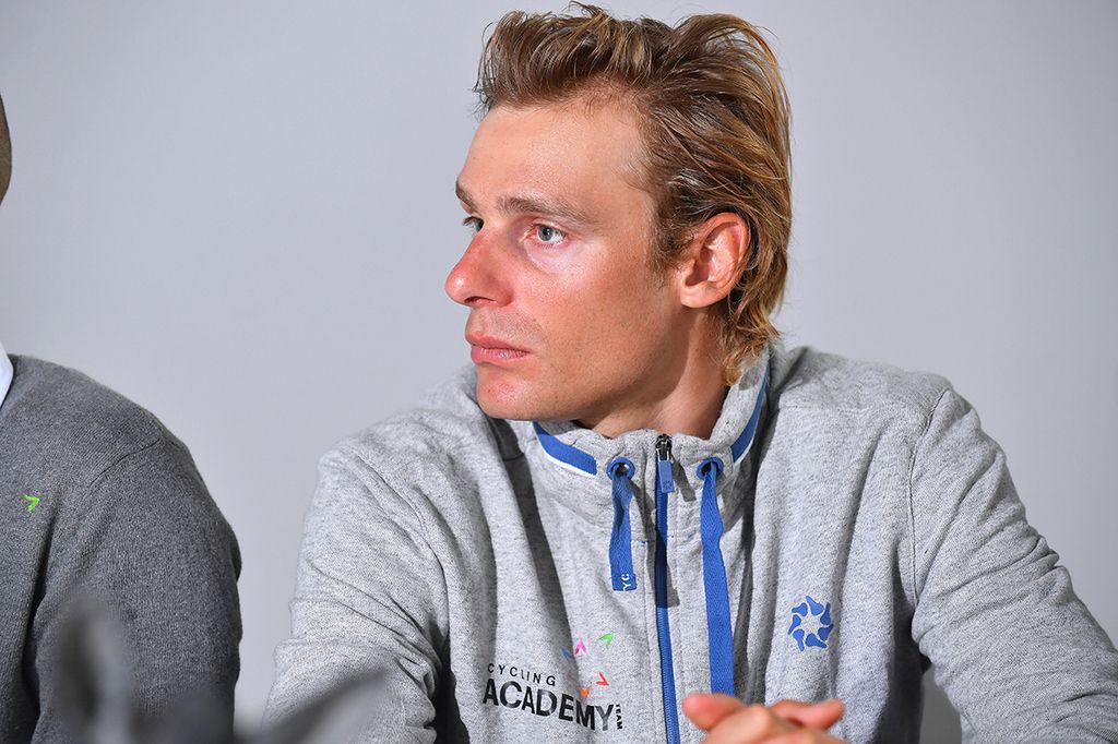 Cycling Academy Team rider Dennis van Winden listening