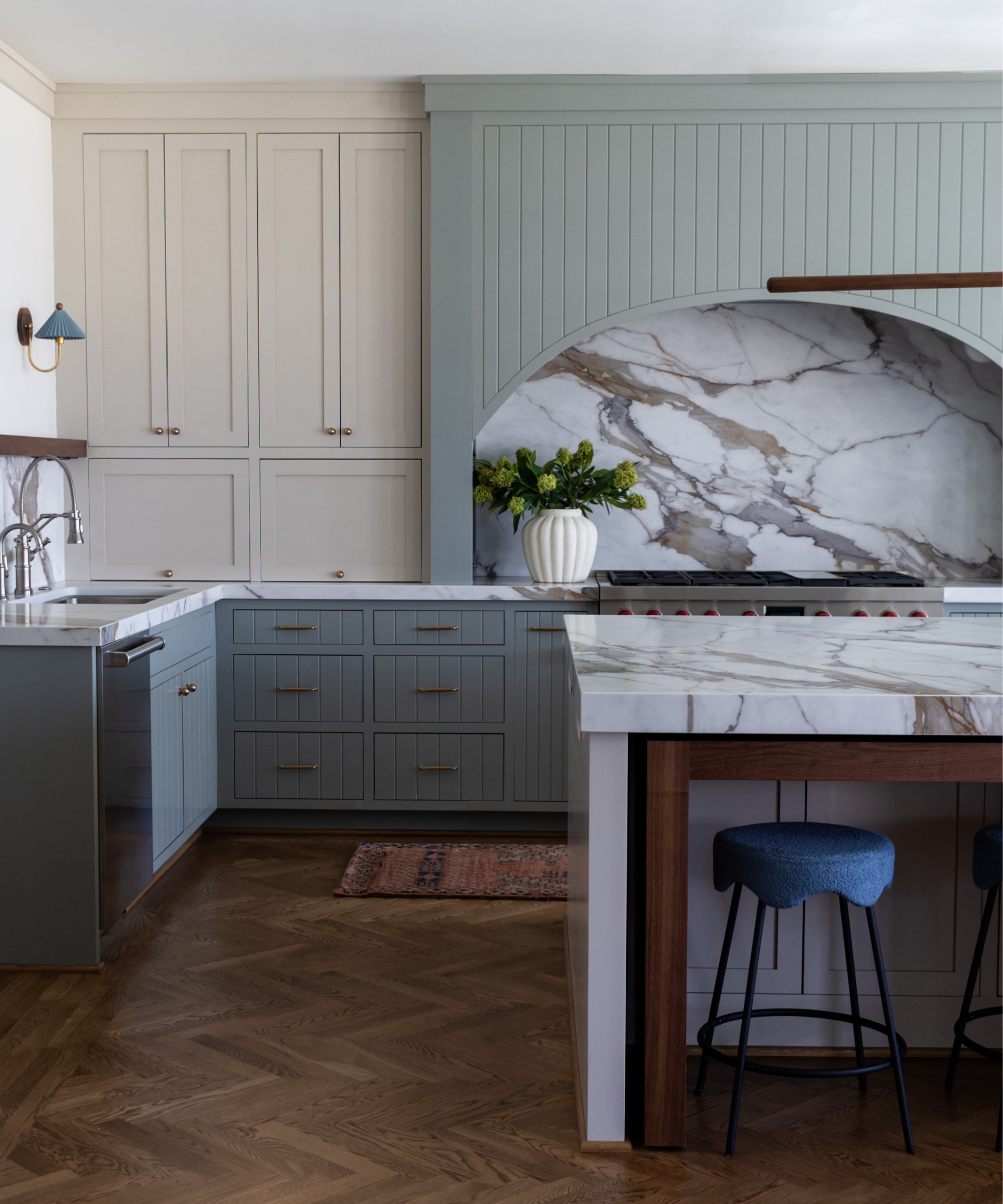 A large modern kitchen with cabinets painted in Pigeon by farrow &amp;amp; Ball