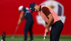 Justin Rose watches a putt after hitting it 