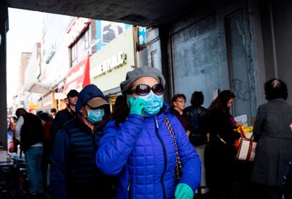 New Yorkers wear masks in Queens