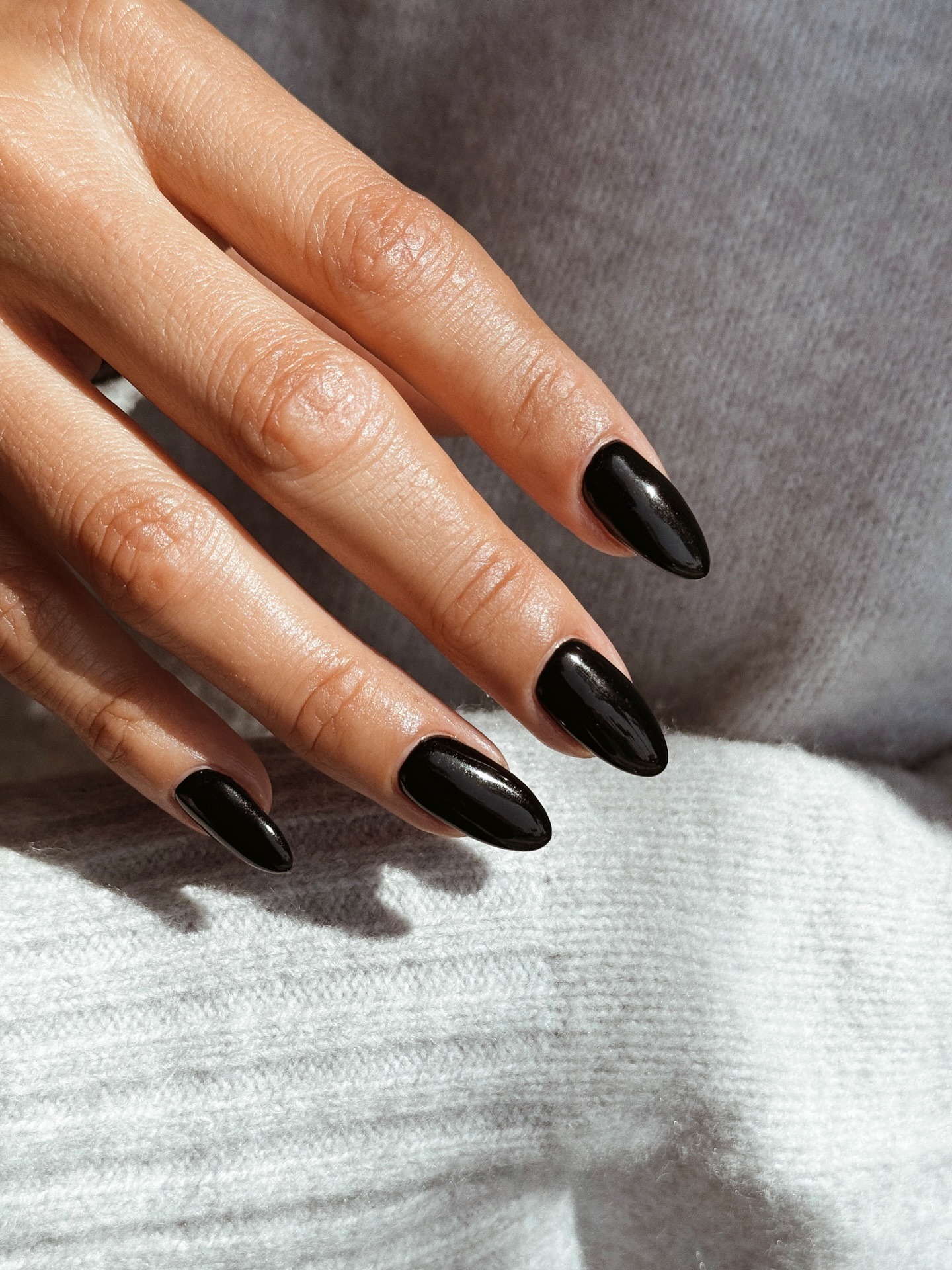 An image of a black manicure.