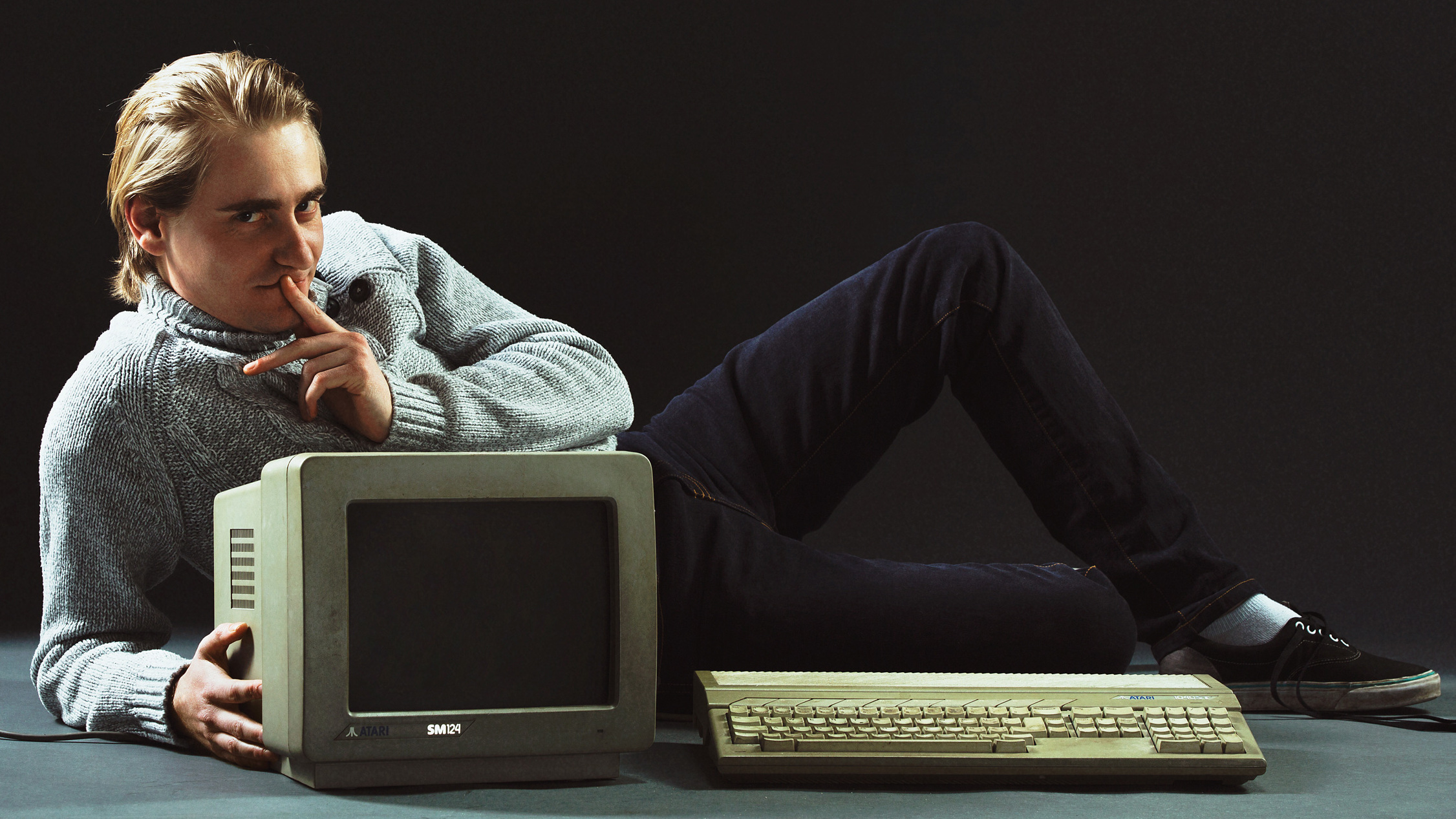 Remi Gallego from Algorithm poses with an old Atari system