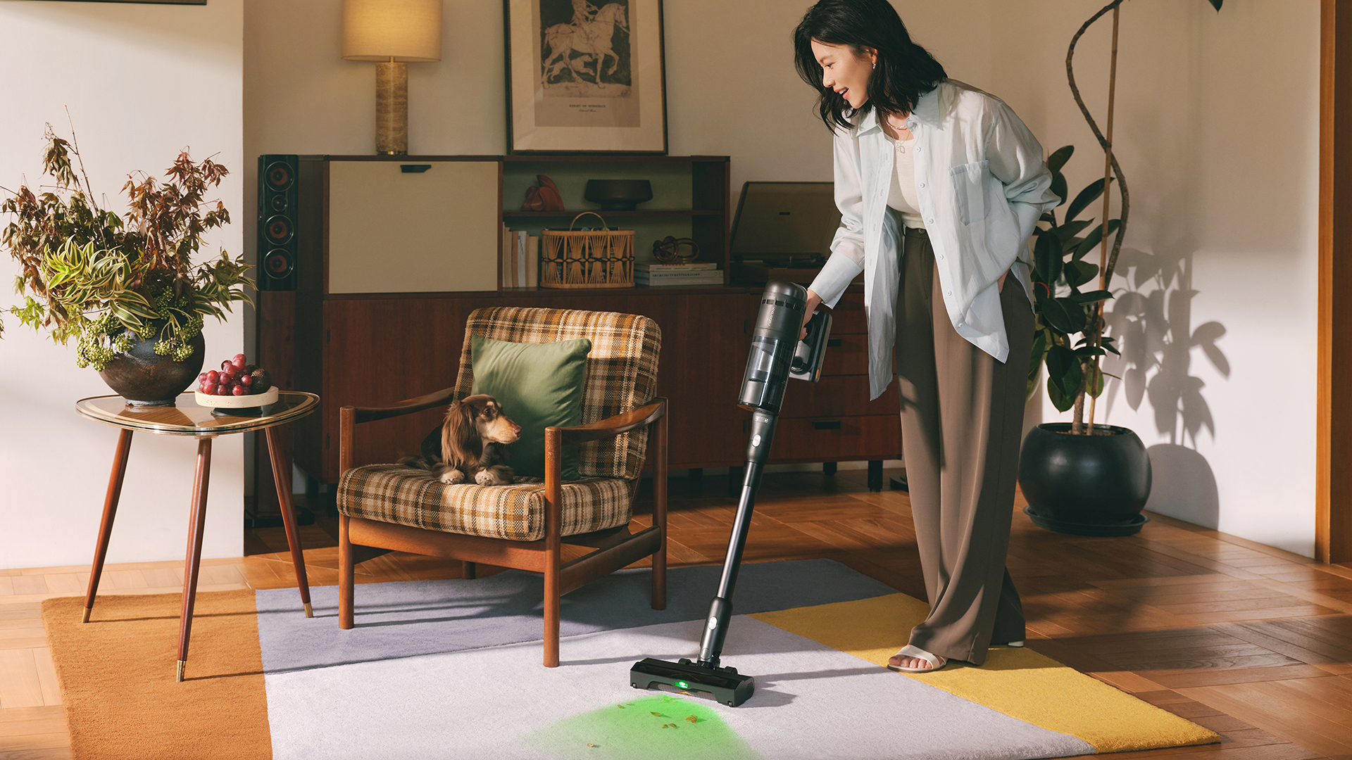 Woman cleaning with Roborock H60 Hub ultra