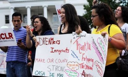 Immigration activists gather in front of the White House on June 15 to celebrate the Obama Administration's announcement that it will stop deporting young illegal immigrants. A new Bloomberg 