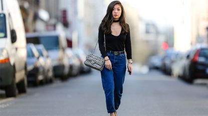 melbourne, australia may 2 fashion blogger holly titheridge wearing black sunglasses, a white topshop button shirt, black topshop denim jeans, black alias mae heel sandals, black yves saint laurent bag on may 2, 2016 in melbourne, australia photo by christian vieriggetty images