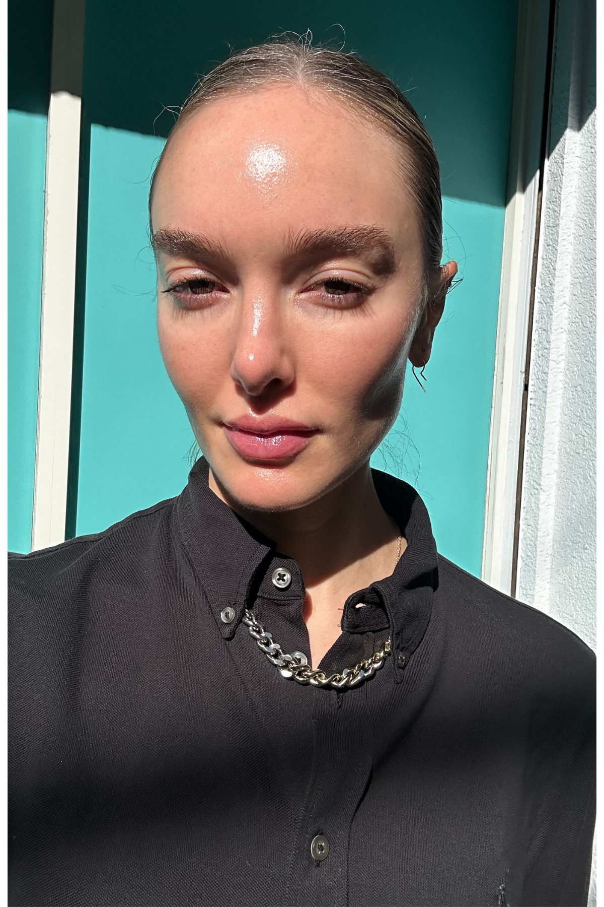 Hannah Baxter with bare skin and a black shirt