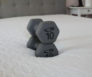 Weights in the middle of the Zinus Cooling Green Tea Mattress.