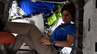 European astronaut Samantha Cristoforetti posing at the hatch between the International Space Station and the Cygnus cargo capsule ahead of the capsule's departure in June 2022.