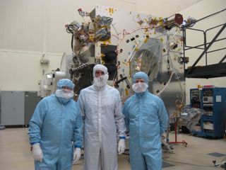 Well-dressed and entering Maven's haven, are, left to right: SPACE.com's Leonard David; Jeff Coyne, Maven assembly, test and launch operations (ATLO) manager at Lockheed Martin; and Gary Napier, communications specialist for Lockheed Martin Space Systems.