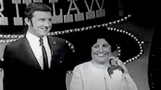 Screenshot of Richard Dawson and female contestant on How's Your Mother-in-Law?