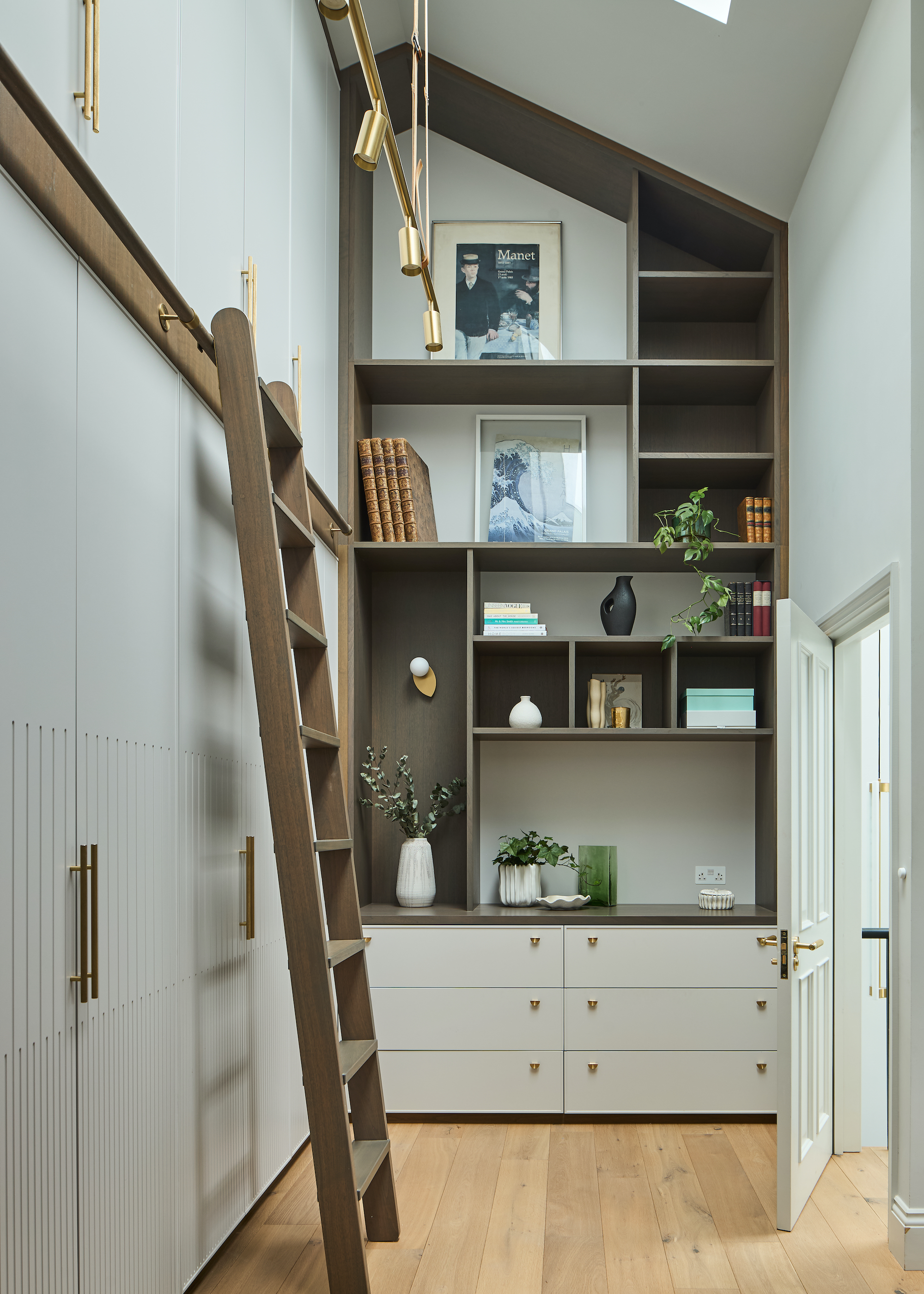 loft conversion with tall storage, ladder and shelving