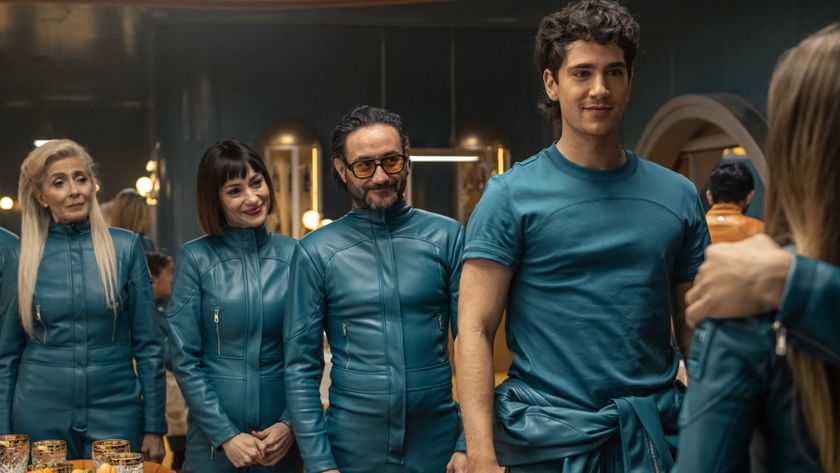 The cast of &quot;Billionaires Bunker&quot; cast in their blue jumpsuits in a scene from the Netflix show