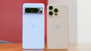 Pixel 8 Pro and iPhone 15 Pro Max next to one another.