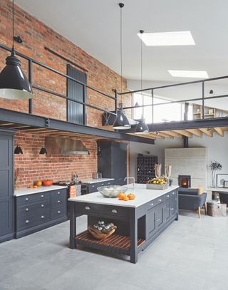 large kitchen extension to brick barn with mezzanine space