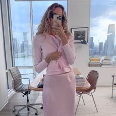 Olympia Gayot wearing the J.Crew featherweight cashmere cardigan, sweater shell, Gwen knee-length slip skirt, and Berkeley bag.