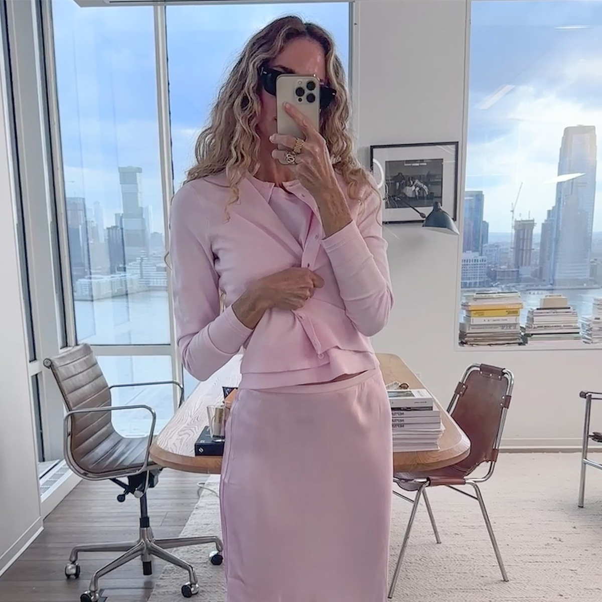 Olympia Gayot wearing the J.Crew featherweight cashmere cardigan, sweater shell, Gwen knee-length slip skirt, and Berkeley bag.