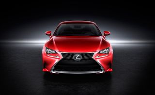 Front view of a red two-door Lexus RC 300h Premier against a black background