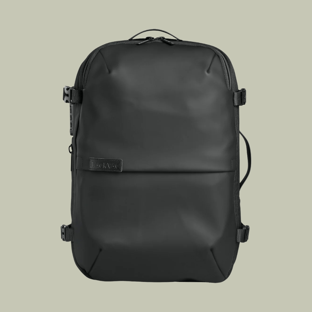 Backvac® Pro backpack in black against a pale green background.