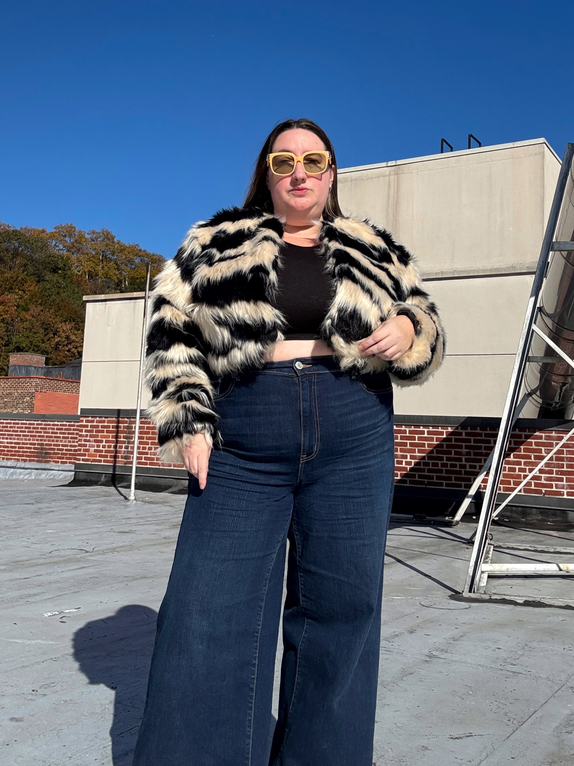 Sarah Chiwaya wearing a faux fur jacket with jeans