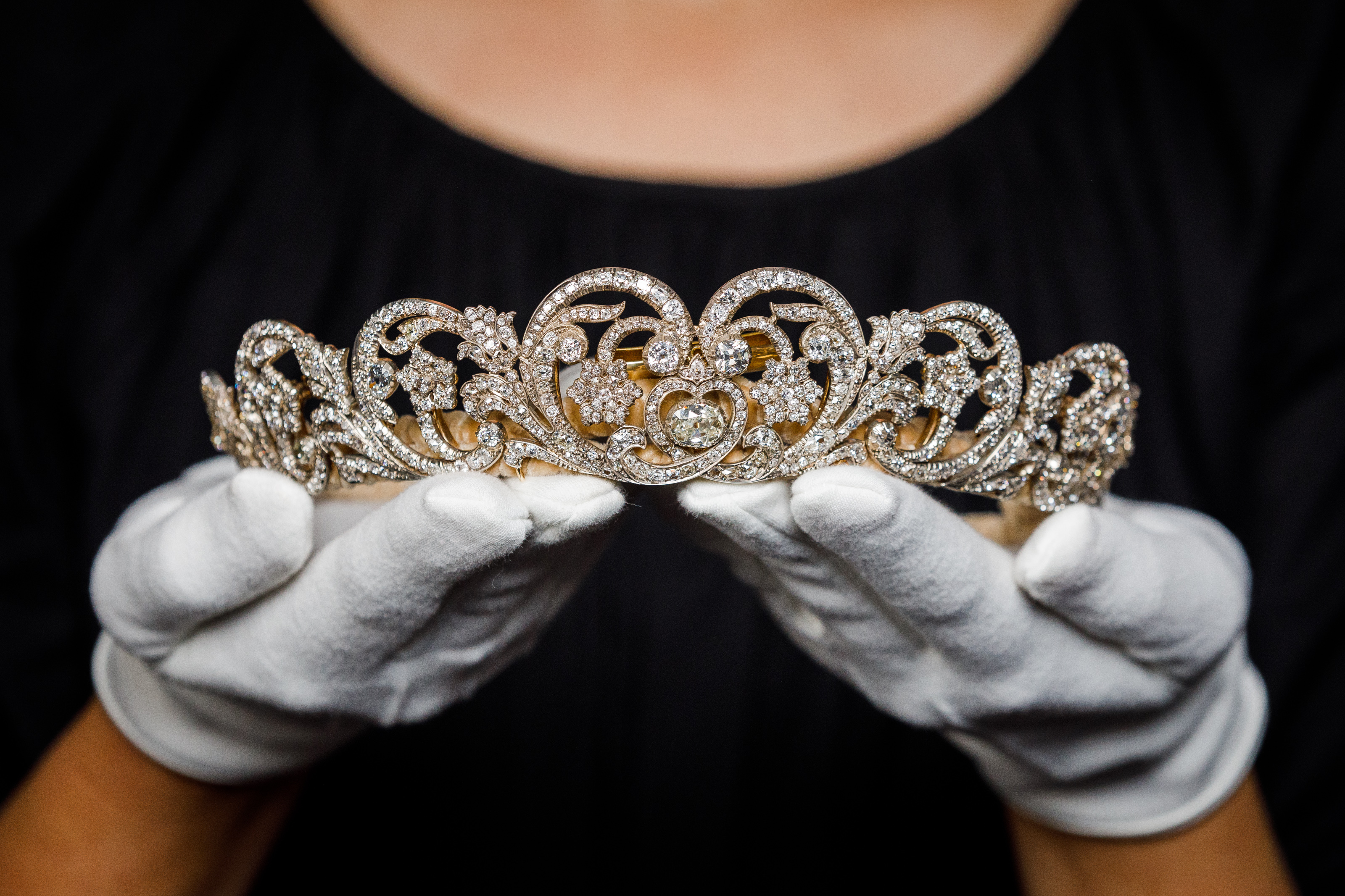 A woman's hands holding the Spencer tiara