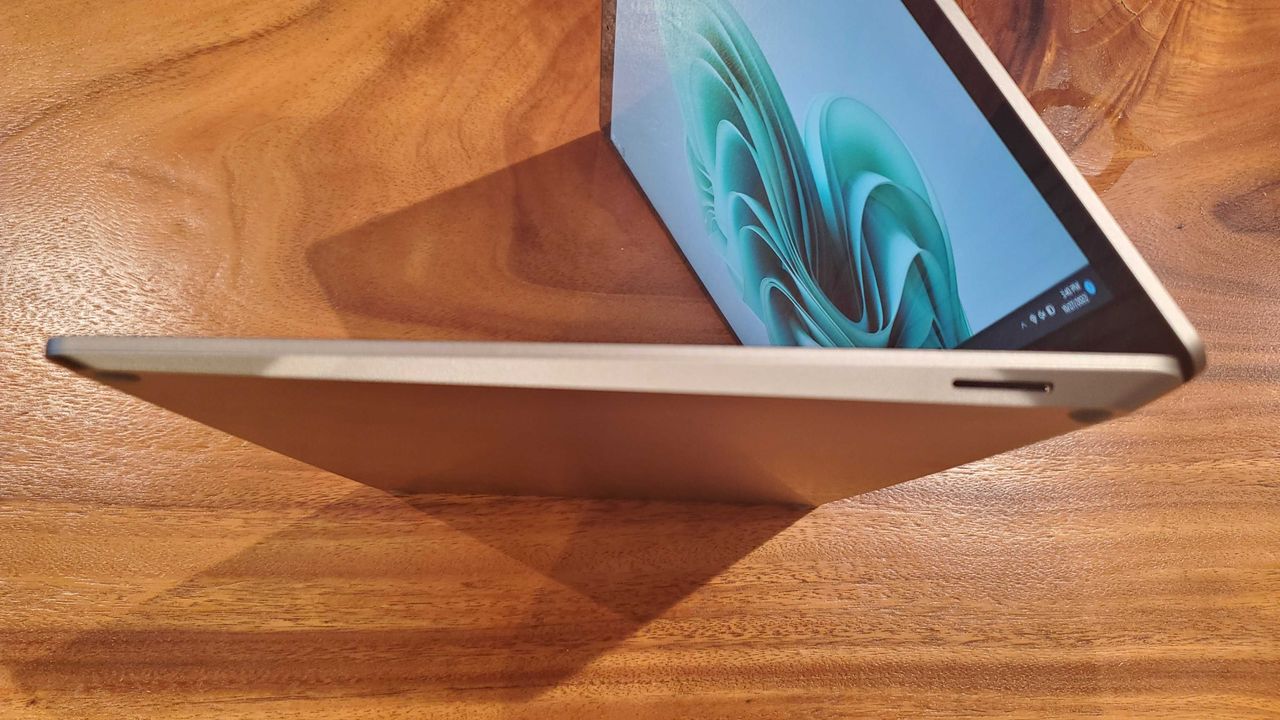 silver laptop sitting on its side