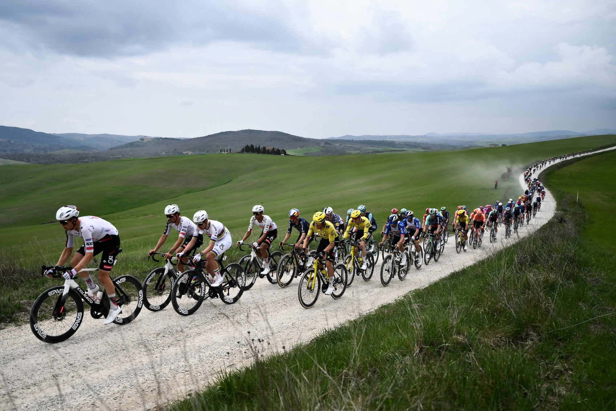 The pack rides during the 20th one-day classic 'Strade Bianche' (White Roads) men's cycling race between Siena and Siena in Tuscany on March 7, 2026. (Photo by Marco BERTORELLO / AFP)