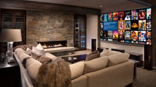 Living room with screen showing Kaleidescape movie library