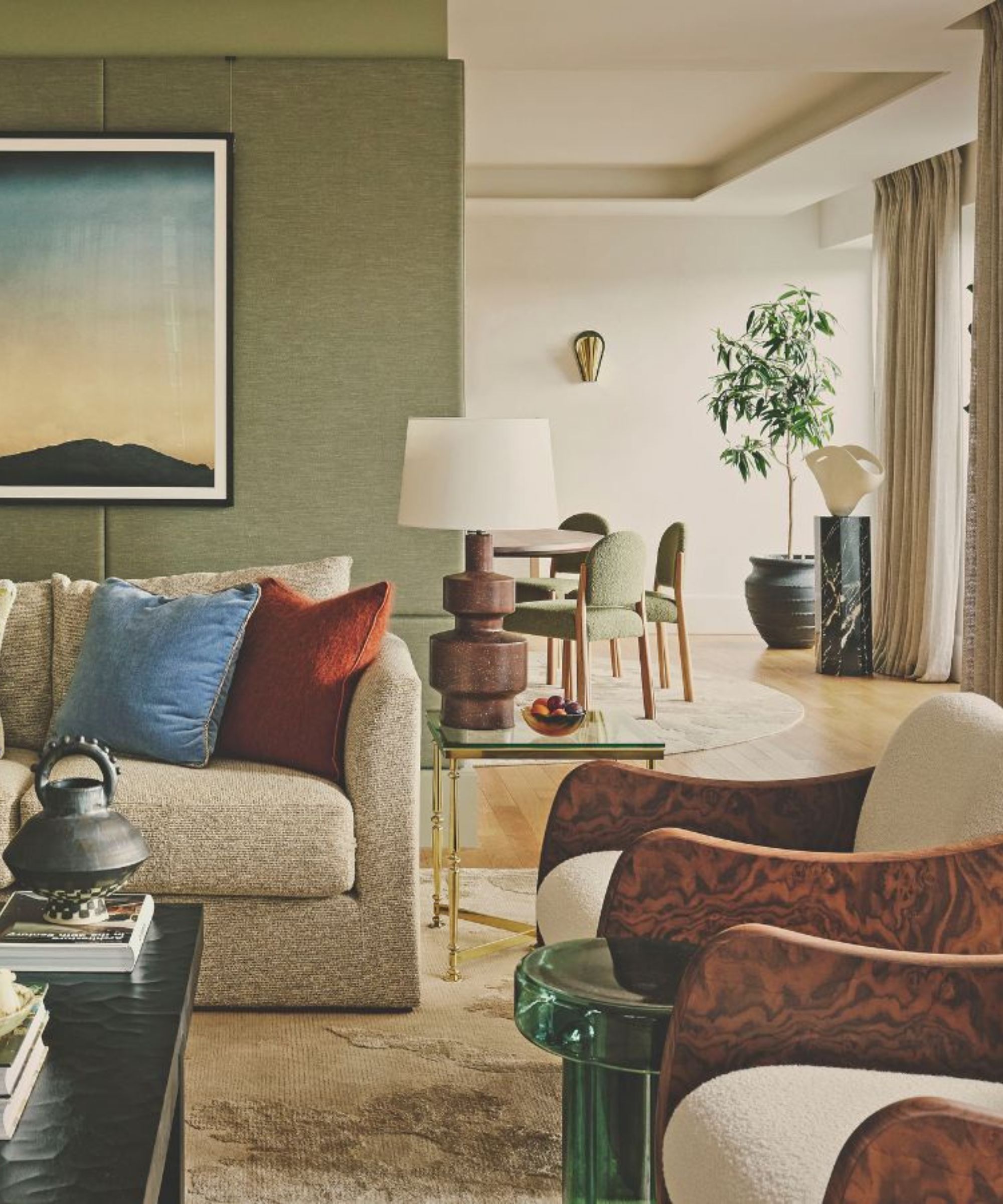 living room with green wall sofa and armchairs